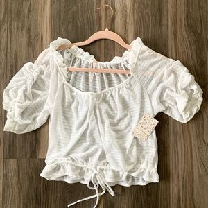 Ivory Free People top! Never been worn.